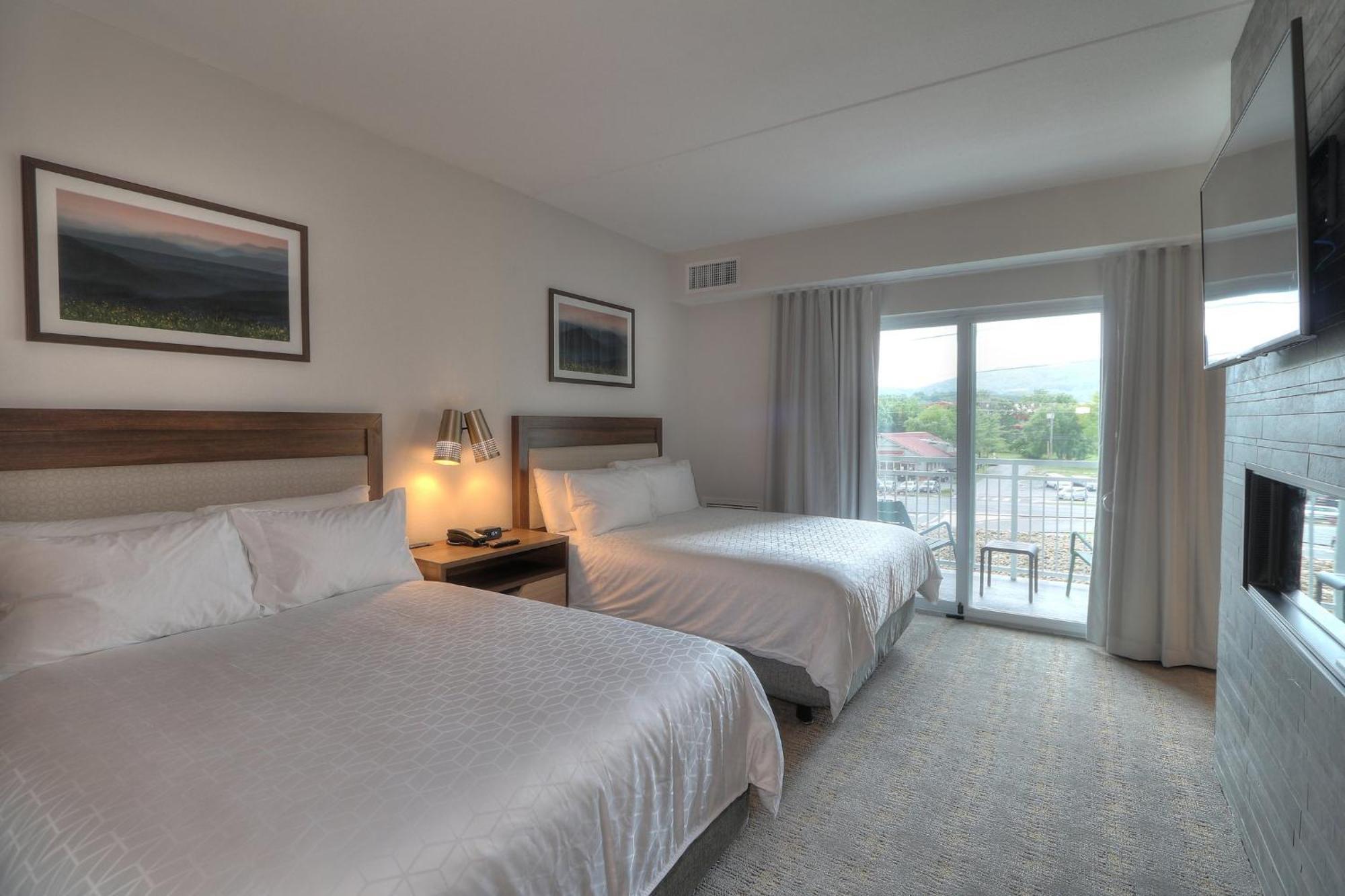 Queen Suite with Two Queen Beds Fireplace and Parkway Balcony